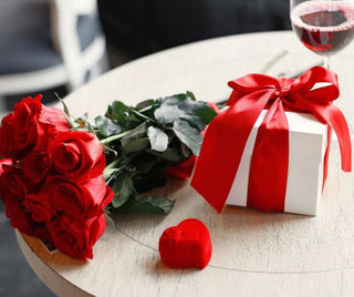 Valentine's Day red roses, gift box, and wine at Design Life Kids